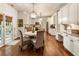 Bright dining area featuring white cabinets, granite counters, and stylish pendant lighting at 4401 Madison Woods Nw Dr, Marietta, GA 30064