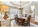 Dining room features a coffered ceiling, shuttered windows, and wood table at 4401 Madison Woods Nw Dr, Marietta, GA 30064