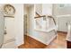 Bright foyer boasts hardwood floors, white stairway, and a classic grandfather clock at 4401 Madison Woods Nw Dr, Marietta, GA 30064