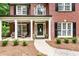 Charming front entrance with a lovely door and manicured landscaping at 4401 Madison Woods Nw Dr, Marietta, GA 30064