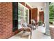Cozy front porch with comfortable seating area, perfect for relaxing outdoors at 4401 Madison Woods Nw Dr, Marietta, GA 30064
