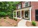 Inviting front porch with seating area, perfect for enjoying the outdoors at 4401 Madison Woods Nw Dr, Marietta, GA 30064