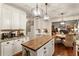 Bright kitchen with white cabinetry, granite countertops, wood island and stainless steel appliances at 4401 Madison Woods Nw Dr, Marietta, GA 30064