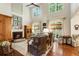 Spacious living room with fireplace, tall windows, and hardwood flooring at 4401 Madison Woods Nw Dr, Marietta, GA 30064