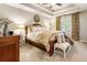 Serene main bedroom featuring a tray ceiling, large windows, and ample natural light at 4401 Madison Woods Nw Dr, Marietta, GA 30064