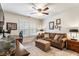 Inviting home office featuring a comfortable sofa, a ceiling fan, and ample desk space for work at 4401 Madison Woods Nw Dr, Marietta, GA 30064