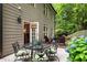 Charming patio featuring a dining set, outdoor seating, and beautiful hydrangea bushes at 4401 Madison Woods Nw Dr, Marietta, GA 30064