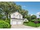Lovely two-story home with two car garage, manicured lawn and mature trees at 4464 Idlewood Park, Lithonia, GA 30038