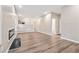Open-concept living room featuring hardwood floors and an electric fireplace insert at 4464 Idlewood Park, Lithonia, GA 30038