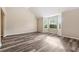 Bright living room with stylish flooring, soaring ceilings and bay windows at 4464 Idlewood Park, Lithonia, GA 30038