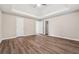 Main bedroom suite boasts a tray ceiling and hardwood floors with open doorway at 4464 Idlewood Park, Lithonia, GA 30038