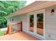 Back deck showcases a lovely outdoor space with stairs leading to the yard and surrounding nature at 1863 Rockford Ct, Riverdale, GA 30296