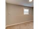 Unfinished basement with a small window providing natural light at 1863 Rockford Ct, Riverdale, GA 30296