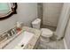 Well-lit bathroom with granite vanity, tiled floors and updated shower with tiled surround at 1863 Rockford Ct, Riverdale, GA 30296