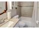 Cozy bathroom featuring a granite vanity and shower-tub combination with tiled surround at 1863 Rockford Ct, Riverdale, GA 30296