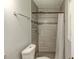 Updated bathroom featuring tiled floors and shower with tiled surround at 1863 Rockford Ct, Riverdale, GA 30296
