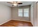 Cozy bedroom with wood-look floors, window, and closet at 1863 Rockford Ct, Riverdale, GA 30296
