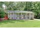 Charming home with a well-manicured lawn and beautiful, gray painted brick exterior at 1863 Rockford Ct, Riverdale, GA 30296