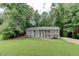 Charming home with a well-manicured lawn and beautiful, gray painted brick exterior at 1863 Rockford Ct, Riverdale, GA 30296
