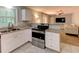 Open kitchen with stainless steel appliances, granite counters, and access to living space at 1863 Rockford Ct, Riverdale, GA 30296