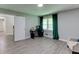 Living room with gray walls, wood-look flooring, and modern decor at 1863 Rockford Ct, Riverdale, GA 30296