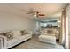 Inviting living room with modern decor, seamlessly connected to a bright, white kitchen at 1863 Rockford Ct, Riverdale, GA 30296