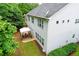 Inviting backyard features a quaint covered patio and a lush, well-maintained lawn perfect for outdoor relaxation at 2940 Bentbill Xing, Cumming, GA 30041