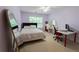 Bedroom with a bed, desk, and purple walls at 2940 Bentbill Xing, Cumming, GA 30041
