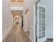 Bright entryway with beautiful hardwood floors, arched doorways, and a view to the dining room at 2940 Bentbill Xing, Cumming, GA 30041