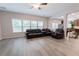 Open living room with lots of windows and view to kitchen area at 2940 Bentbill Xing, Cumming, GA 30041