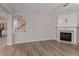 Bright living room with fireplace and view of staircase at 2940 Bentbill Xing, Cumming, GA 30041