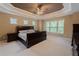 A spacious main bedroom with natural light, large bed, and matching furniture at 2940 Bentbill Xing, Cumming, GA 30041