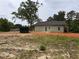 Backyard featuring a brand new home, a dumpster, and a yard under construction at 389 Campground School Rd, Dallas, GA 30157