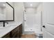Modern bathroom featuring dark wood vanity and shower at 389 Campground School Rd, Dallas, GA 30157