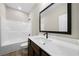 Bathroom featuring a modern vanity with a large mirror and tub with shower at 389 Campground School Rd, Dallas, GA 30157