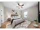 Bright bedroom with a ceiling fan, light-colored walls, and stylish decor at 389 Campground School Rd, Dallas, GA 30157