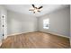 Spacious bedroom with laminate flooring, neutral paint, a ceiling fan, and natural light at 389 Campground School Rd, Dallas, GA 30157