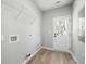 Clean laundry room with wire rack shelving and outdoor access at 389 Campground School Rd, Dallas, GA 30157