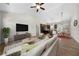 Inviting living room with vaulted ceilings, contemporary furnishings, and views of the kitchen and dining area at 389 Campground School Rd, Dallas, GA 30157