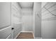 Walk-in closet with laminate floors and wire shelving at 389 Campground School Rd, Dallas, GA 30157