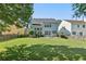 Large backyard with green grass, patio, and the home in the background at 4020 Emerald Glade Ct, Cumming, GA 30040
