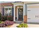 Charming home with a brick facade, well-manicured landscaping, and attached garage at 4020 Emerald Glade Ct, Cumming, GA 30040