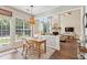Eat-in kitchen area with natural light and an open view into the great room featuring high ceilings at 4020 Emerald Glade Ct, Cumming, GA 30040