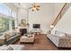 Bright living room with vaulted ceilings, a fireplace, hardwood floors, and stylish furniture at 4020 Emerald Glade Ct, Cumming, GA 30040