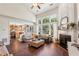 Spacious living room with high ceilings, fireplace, hardwood floors, and an open floor plan at 4020 Emerald Glade Ct, Cumming, GA 30040