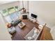 Living room boasts hardwood floors, high ceilings, and a fireplace, viewed from the second story at 4020 Emerald Glade Ct, Cumming, GA 30040
