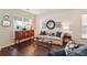 Inviting living room boasts hardwood floors, neutral paint, with comfortable seating and decor at 4020 Emerald Glade Ct, Cumming, GA 30040