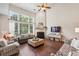 Bright living room boasts high ceilings, large windows, a fireplace, and stylish furniture arrangement at 4020 Emerald Glade Ct, Cumming, GA 30040