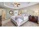 Spacious main bedroom featuring a trey ceiling, neutral walls, and carpet at 4020 Emerald Glade Ct, Cumming, GA 30040