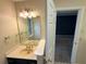 Traditional bathroom featuring a single sink vanity, neutral walls, and recessed lighting at 1035 Towne Manor Nw Ct, Kennesaw, GA 30144